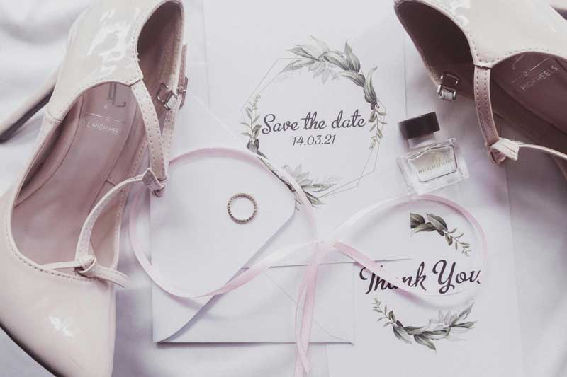 Wedding stationery suite printed at W. O. Jones, showing invitations, RSVP cards and an order of service